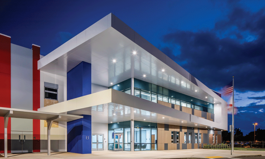 Front view of the A.D. Henderson main campus entrance at night